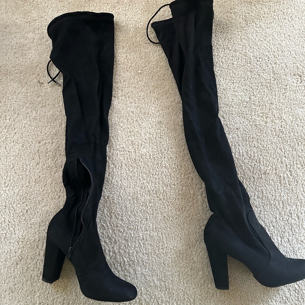 Black thigh high boots! Only worn 2 times. Very comfortable.